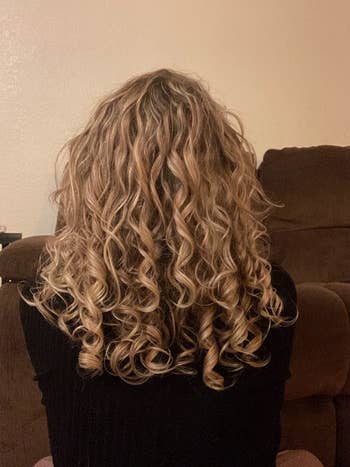 image of reviewer with blonde, ribbon-like curls