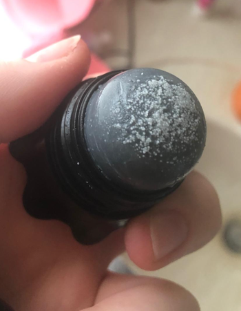 the cap off to show the salt on the top of the remover