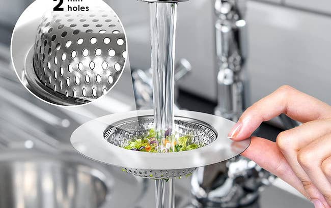 person holding a sink strainer