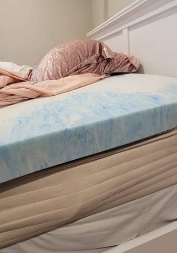 3 inch blue and white topper on reviewer's bed