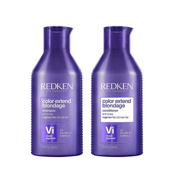 A purple shampoo and conditioner bottles on a white background