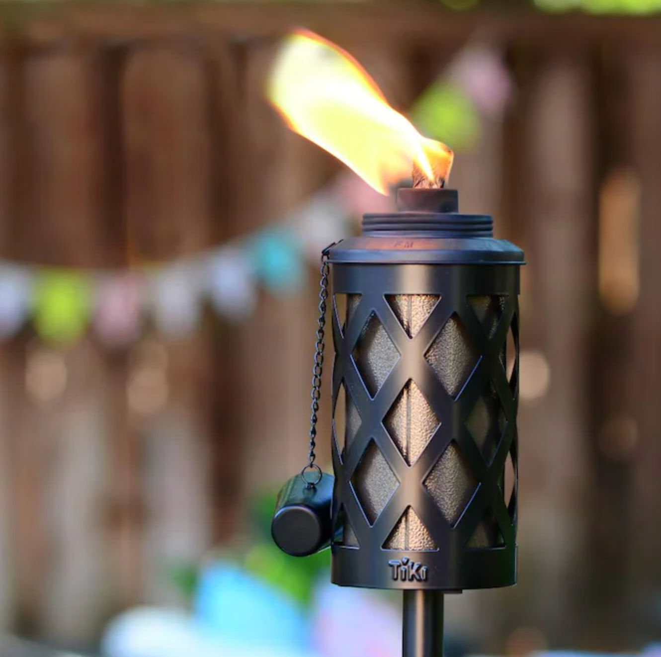 photo of the Tiki torch with citronella on fire