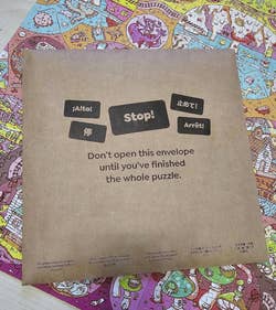 extra puzzle bag that says don't open this envelope until you've finished the whole puzzle
