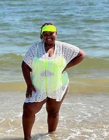 Reviewer wearing white swim coverup