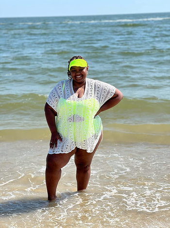Reviewer wearing white swim coverup