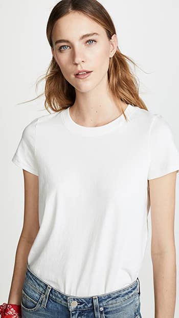 front view of a model wearing the white tee