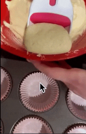 gif of reviewer using scooper to scoop batter and put into cupcake liner