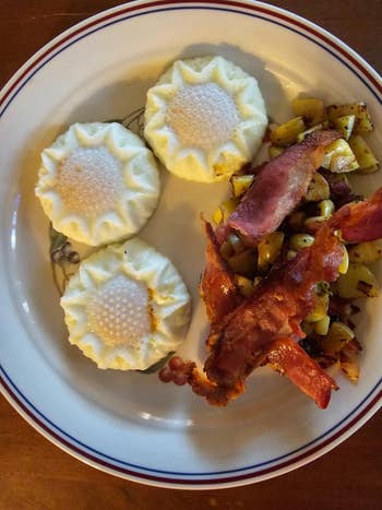 A plate of sunflower shaped poached eggs and bacon