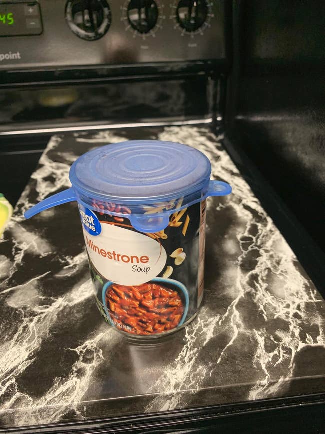 a can of minestrone soup with a silicone lid on it