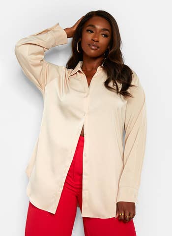 model wearing cream colored button up