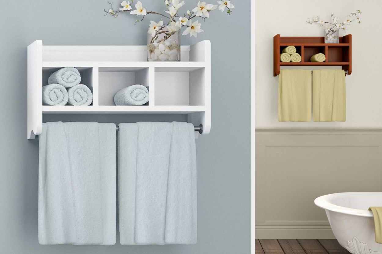 White wall mounted shelf with cubbies and towel bar with towels inside, product in brown hanging on white wall next to bathtub