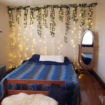 various strands of ivy arranged behind a bed