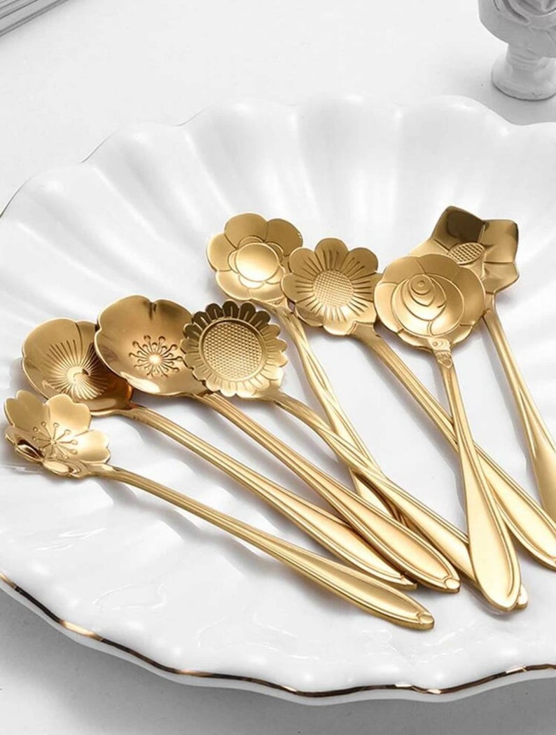gold teaspoons with flower shaped scoops