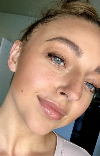 reviewer wearing lifter gloss on lips