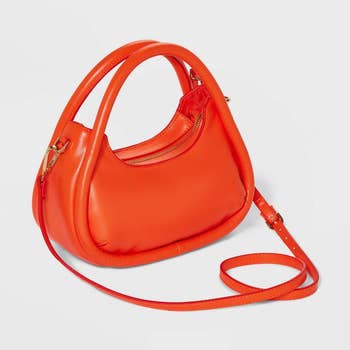 rounded orange crossbody bag