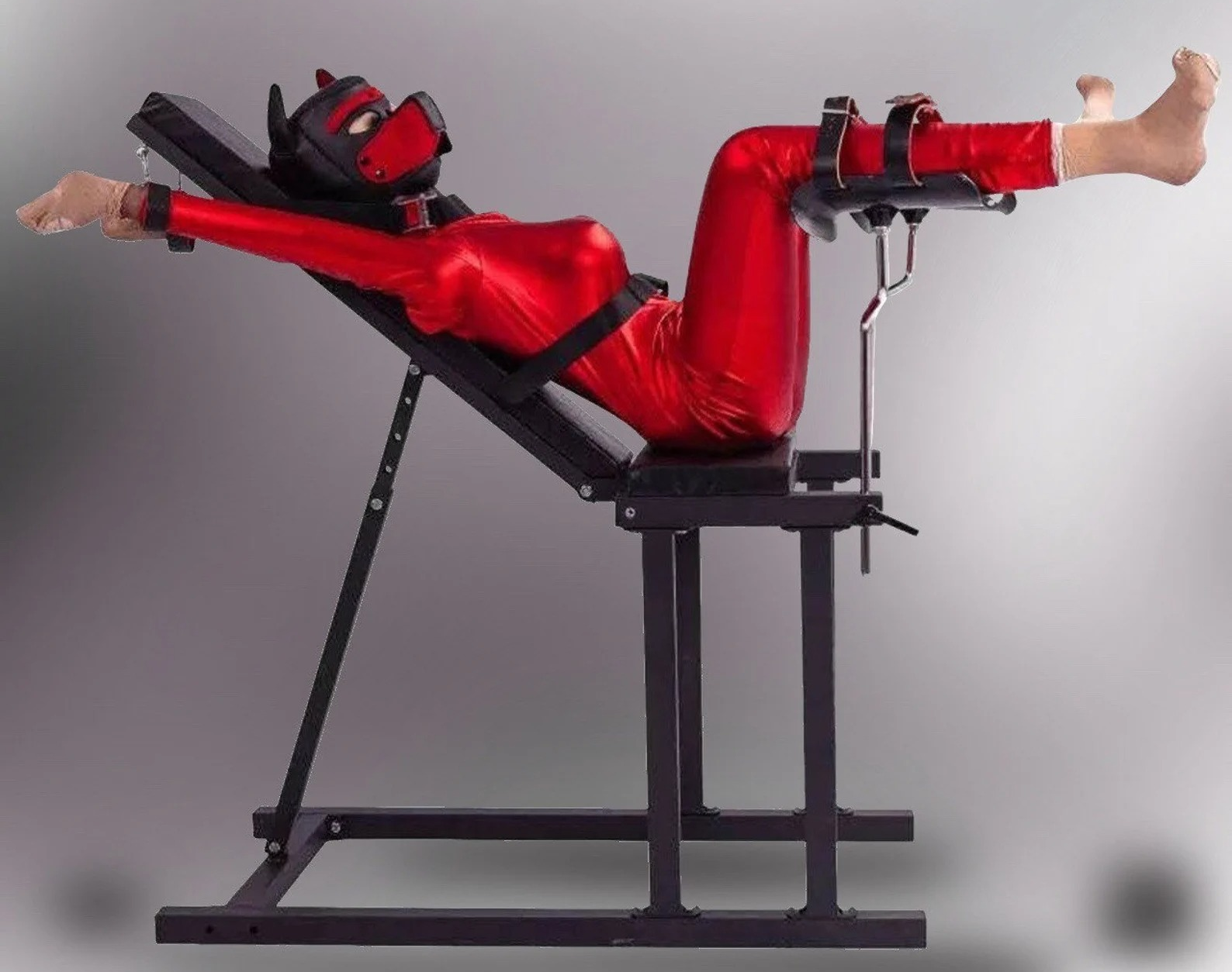 a model sprawled on an adjustable black bondage chair