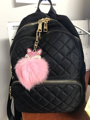 reviewer photo of black quilted mini backpack
