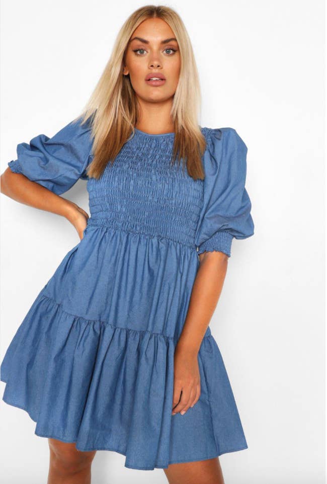 Model in smocked chambray midi tiered swing dress with puff short sleeves 