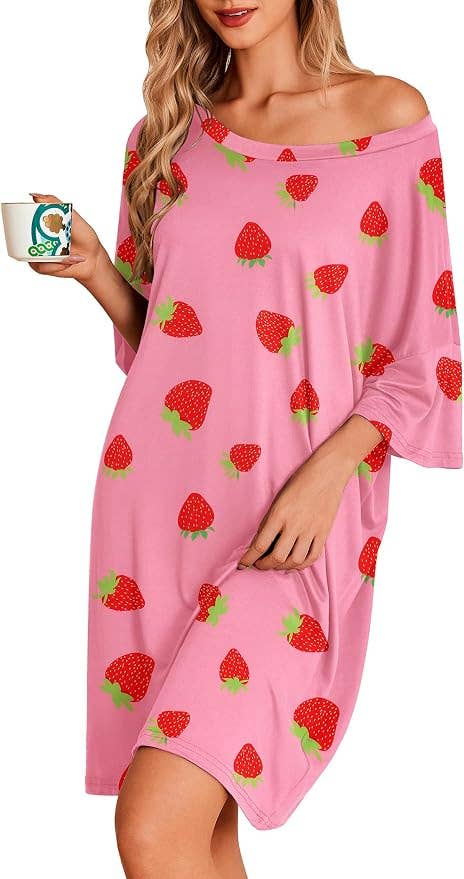 Person successful strawberry-print formal holds a mug, showcasing casual loungewear for a buying article