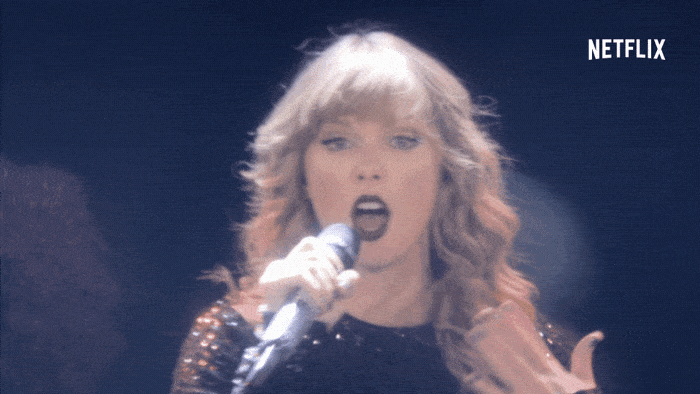a gif of taylor swift performing on the reputation stadium tour