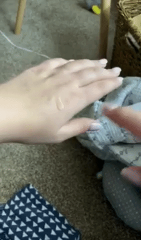 Reviewer video of person rubbing product onto hand