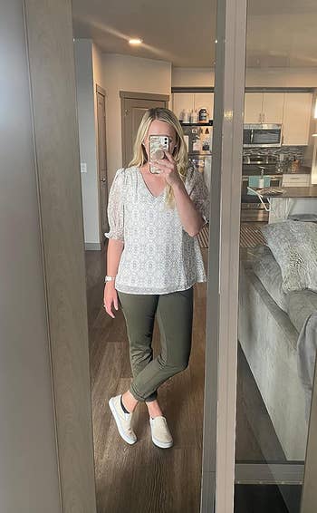 reviewer wearing the pant in olive green