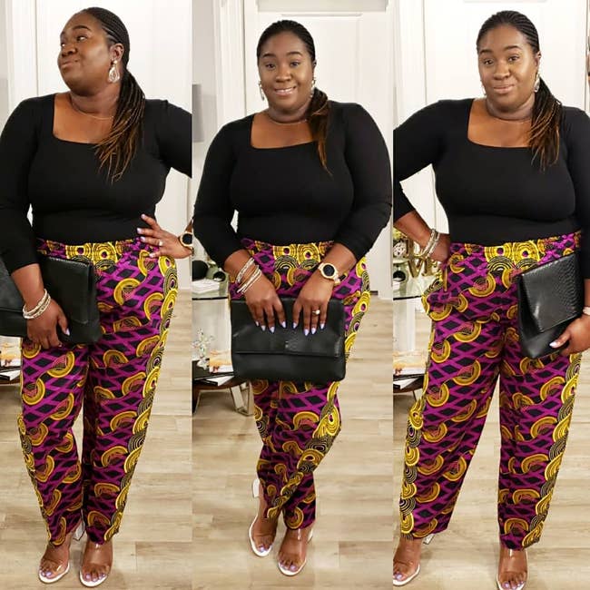 Reviewer in a  black top, patterned pants, holding a clutch, with sandals
