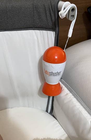 crib with a Baby Shusher device attached to the side