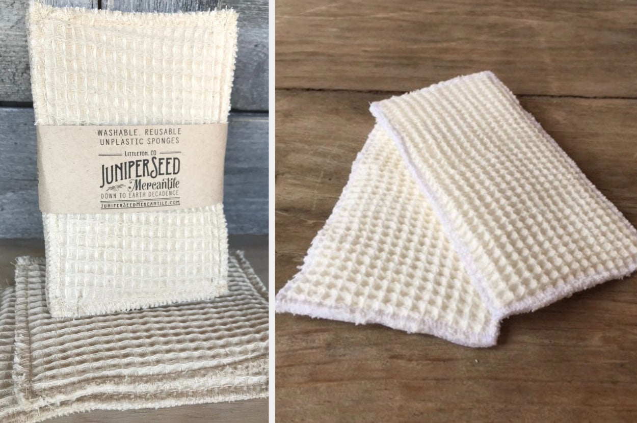 Cream cloth standing in front of wooden background, cloths laying on top of table