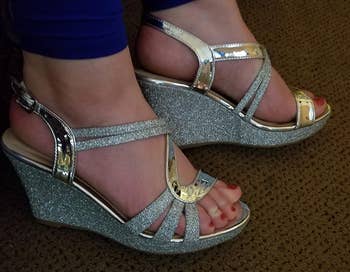 Reviewer wearing the silver sandals