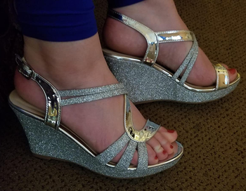Reviewer wearing the silver sandals