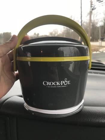 reviewer holding mini crockpot
