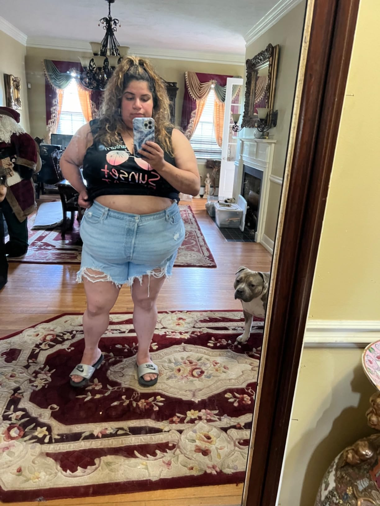 Woman taking a reflector  selfie, wearing a 