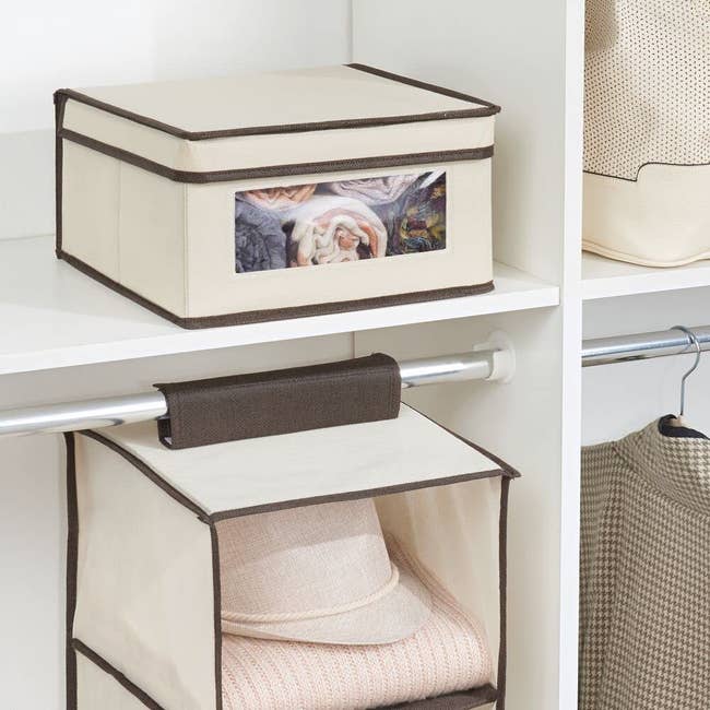 The storage box on a shelf with a clear window to showcase what's inside