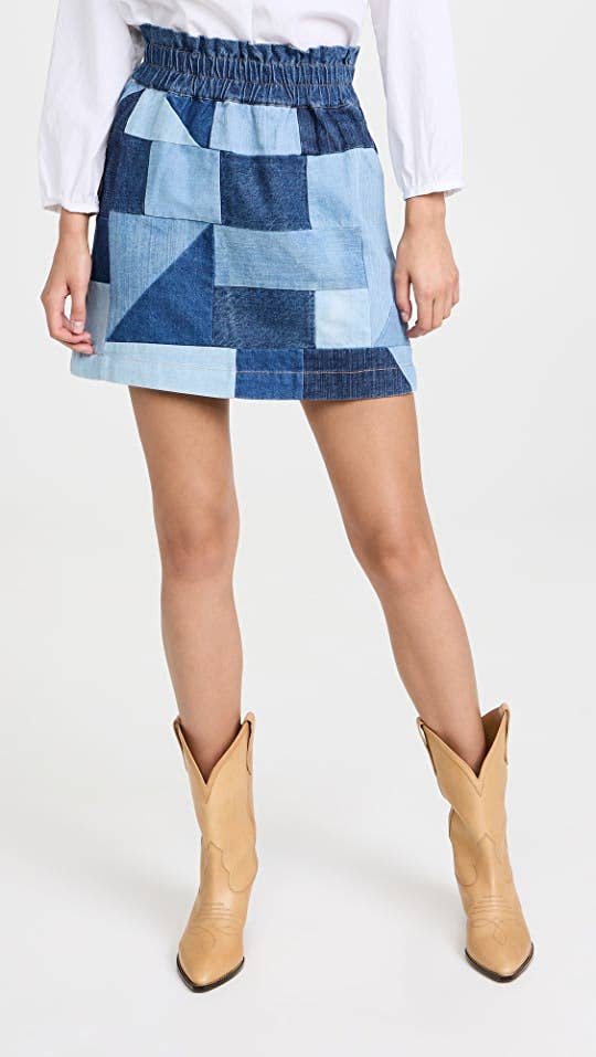 model in blue skirt with patchwork of different washes of denim