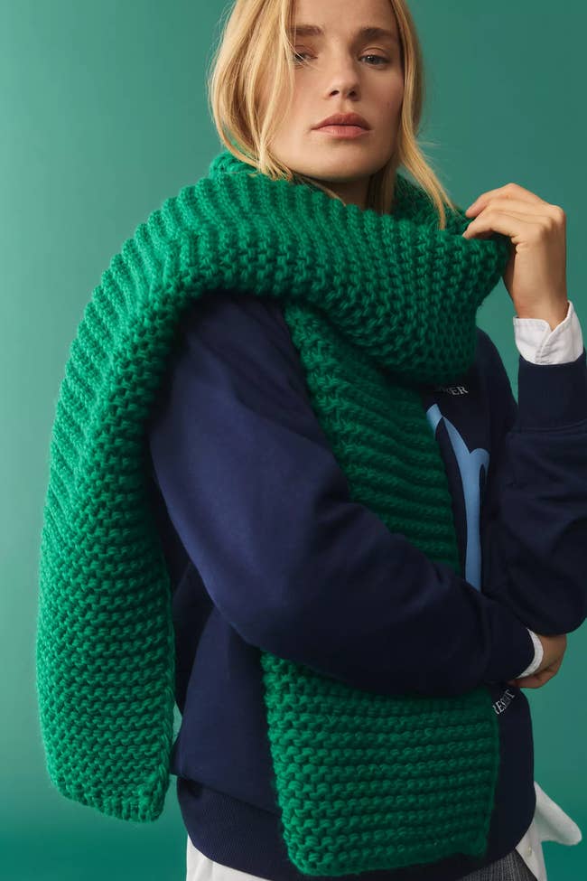 model wears knit scarf