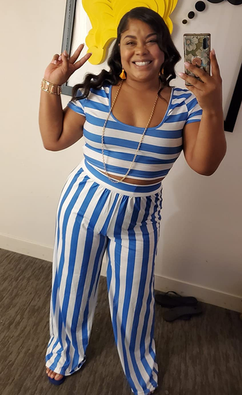 reviewer wearing the blue and white striped pants set