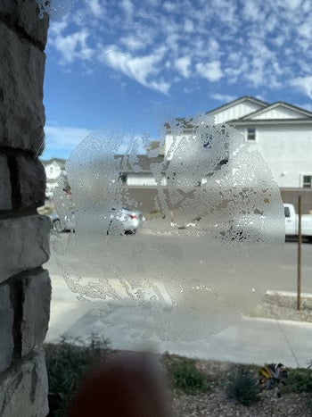 on left, before photo of sticky residue on window