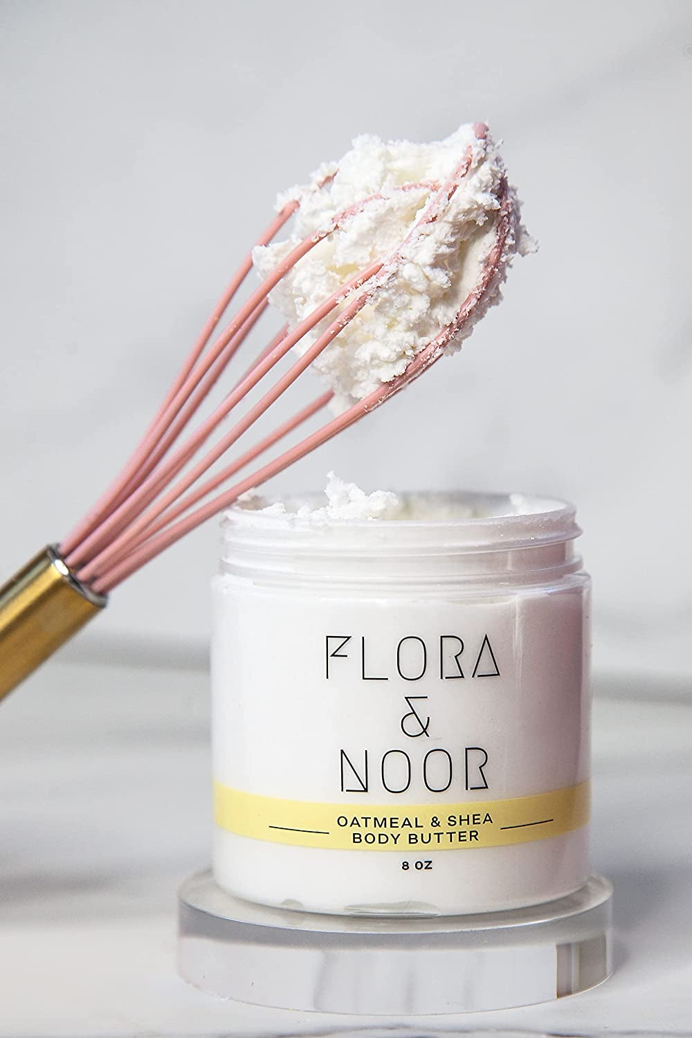 jar of thick body butter next to whisk
