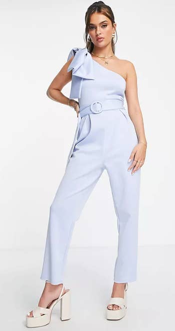 A model posing in the light blue jumpsuit