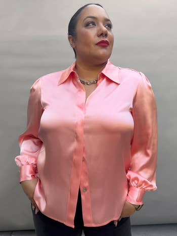 Model in a pink silk blouse