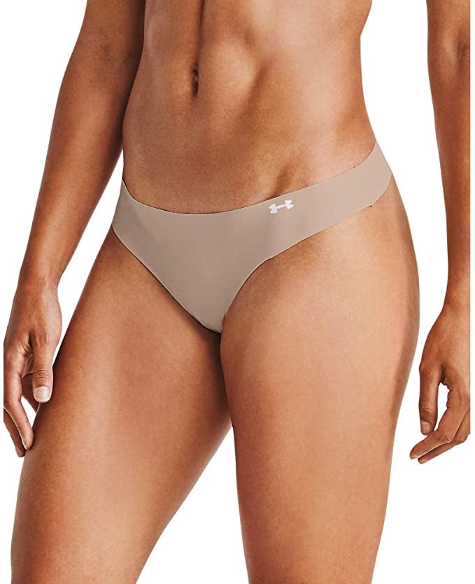 model wearing a beige laser cut thong