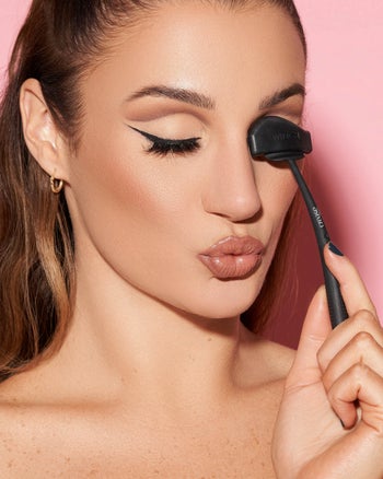 a model using the tool on their eye