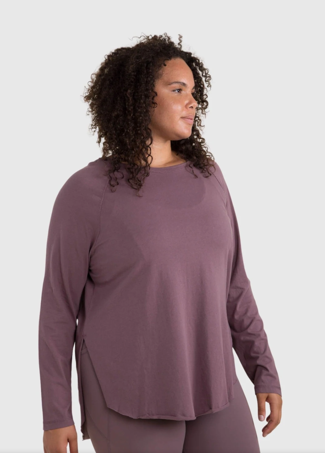model wearing the long-sleeved shirt in purple
