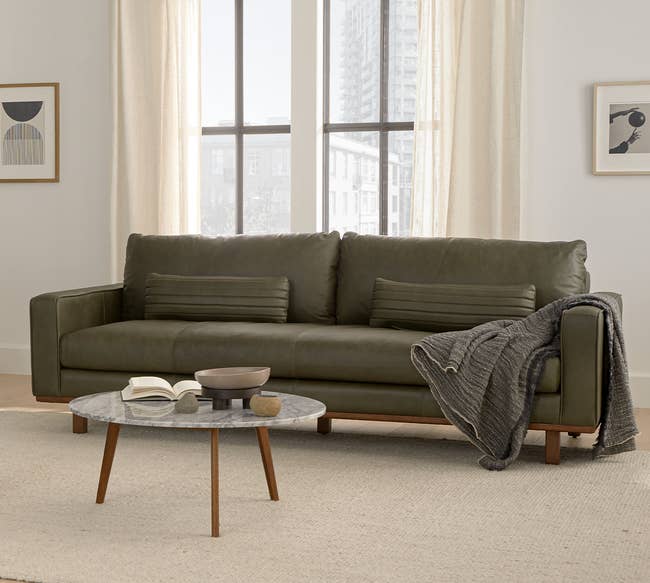 the green leather sofa