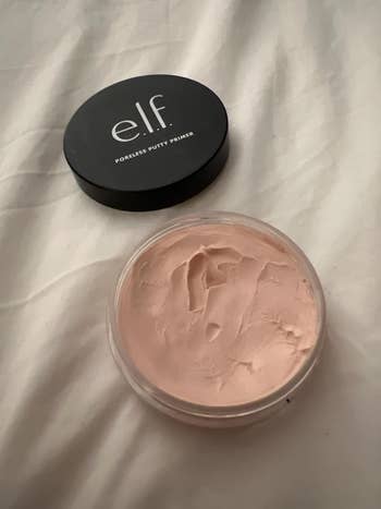 e.l.f. Poreless Putty Primer open on a surface, with the lid nearby