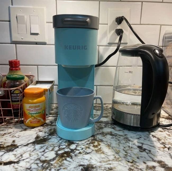 the Keurig in blue on a reviewer's counter