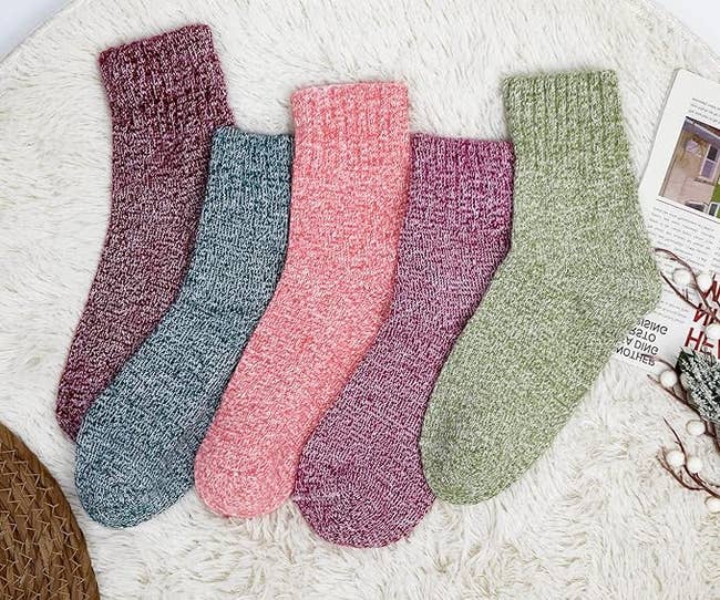 Five pairs of knit socks in a variety of colors