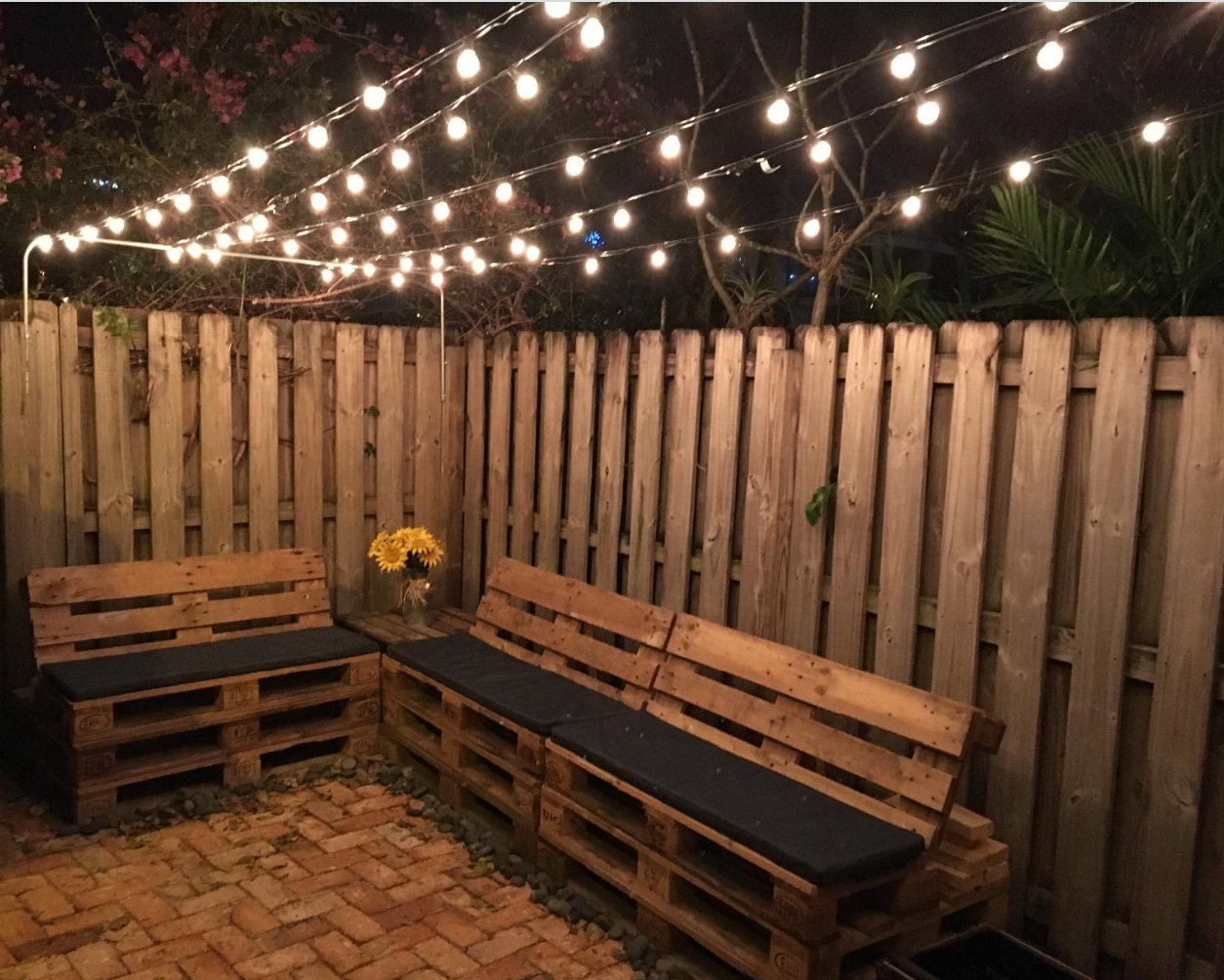 Reviewer photo of the lights strung up in their backyard patio