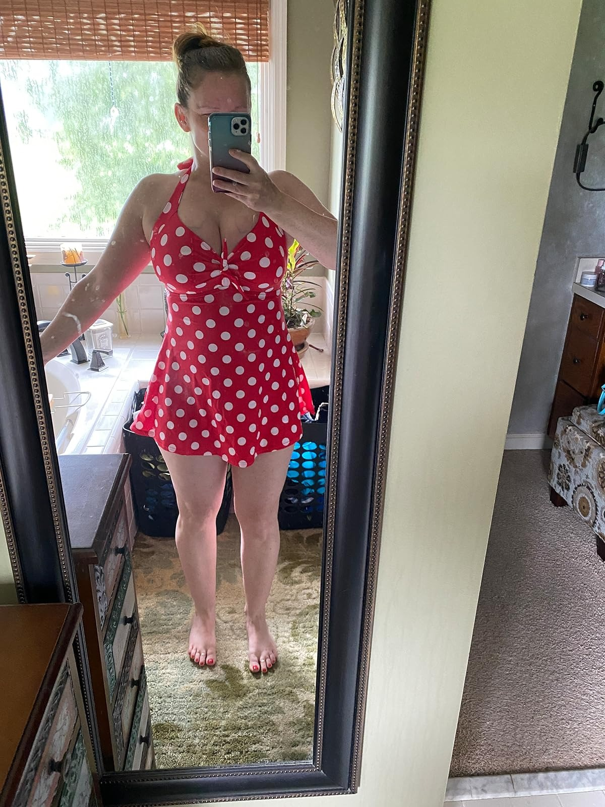 Person taking a reflector  selfie successful  a polka dot swimsuit, lasting  successful  a cozy chamber  oregon  bath  setting